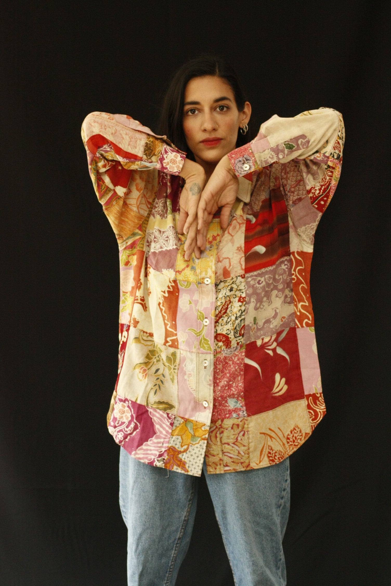The fabric of this garment was found in Nishiki Market, Kyoto. The design was inspired by the street style, art and architecture of Japan. Deadstock pieces of fabric from India, Africa and Japan sewn together. Patchwork shirt with history, a statement garment for a lifetime. INGREDIENTS 100% cotton Mother of pearl buttons (concha de nacar) Ethically made in Ecuador. Sustainable fashion, handmade, natural fibers, vintage textiles and upcycled materials.