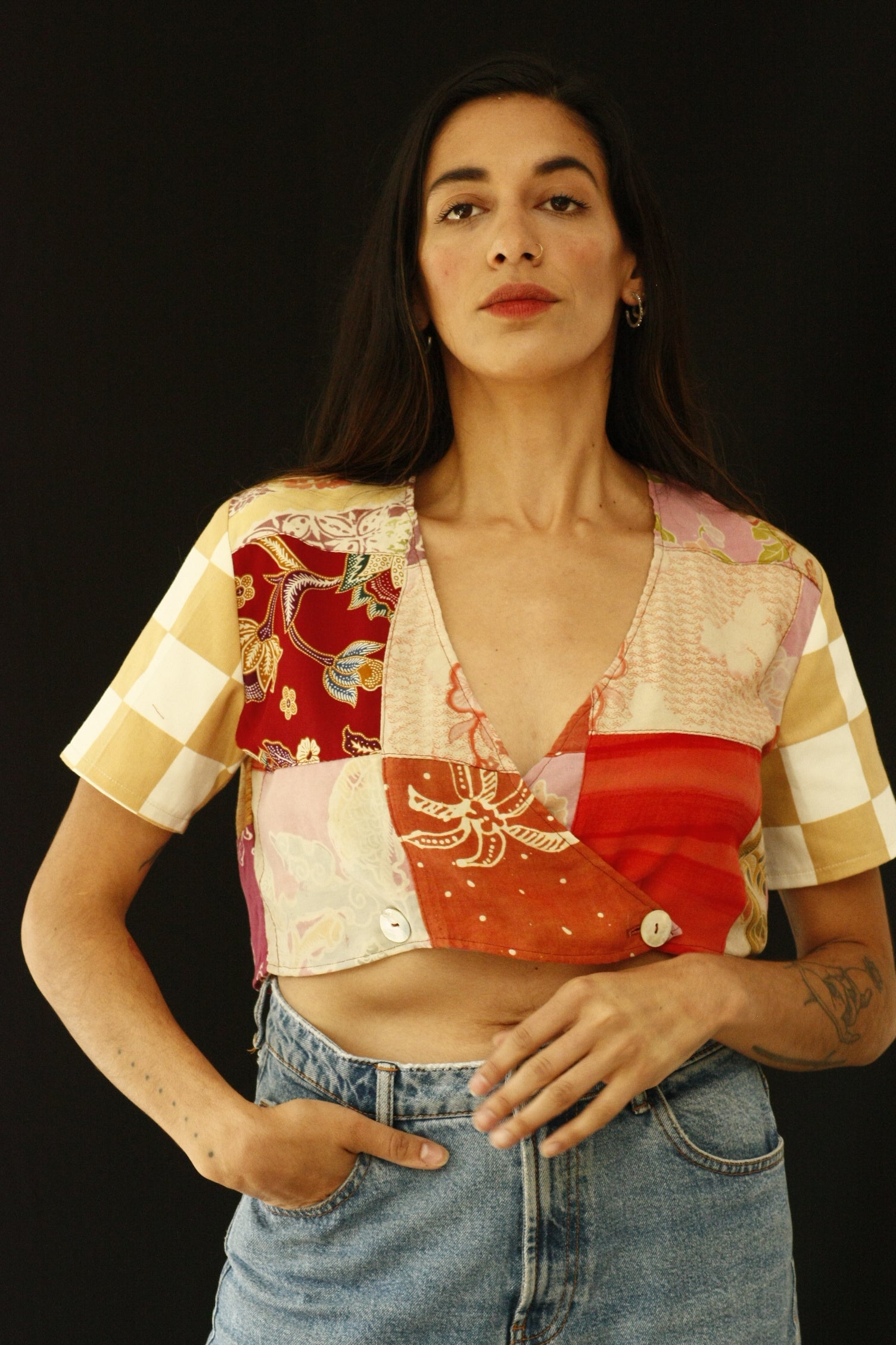 The fabric of this garment was found in Nishiki Market, Kyoto. The design was inspired by the street style, art and architecture of Japan. Deadstock pieces of fabric from India, Africa and Japan sewn together. Patchwork crop top with history, a statement garment for a lifetime. INGREDIENTS 100% cotton Mother of pearl buttons (concha de nacar) Ethically made in Ecuador. Sustainable fashion, handmade, natural fibers, vintage textiles and upcycled materials.