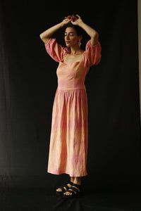 The design was inspired by the street style, art and architecture of Japan. This dress is naturally dyed with turmeric, achiote and cochineal to resemble the colorful japanese rice cake, mochi. INGREDIENTS 100% cotton Turmeric, achiote and cochineal IMPORTANT Natural dyes don't contain harmful chemicals, they are biodegradable, nontoxic and nonallergic. The color can slightly vary with each batch. Ethically made in Ecuador. Sustainable fashion, handmade